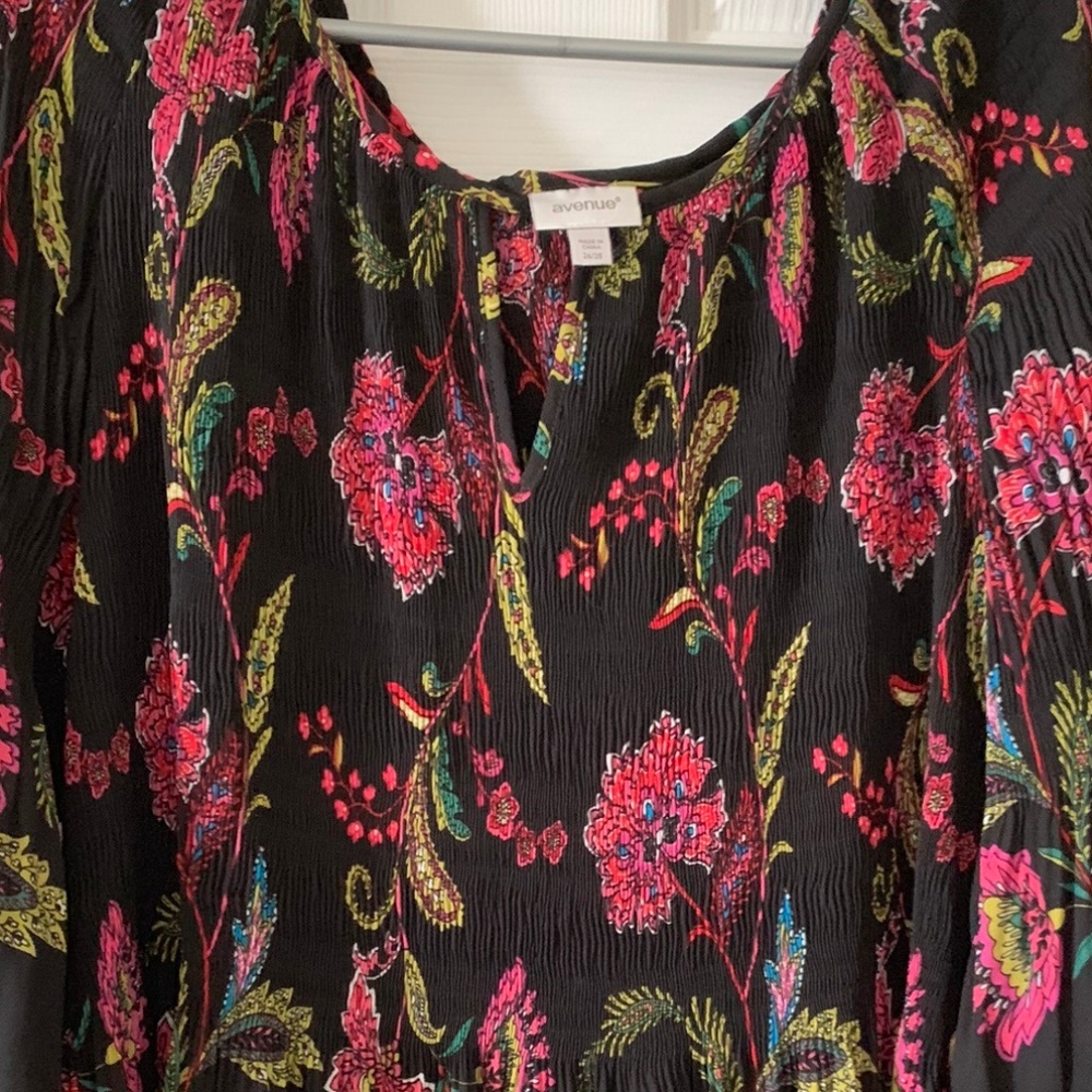 Crinkled style blouse with 3/4 bell sleeves.